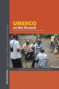 Book cover with title and editors' names above a photo of a man sitting outside surrounded by others as he is being recorded speaking into a voice recorder.