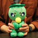 Professor Michael Dylan Foster holds a stuffed kappa made by a student. (Photo by Maria Sestito, UC Davis)